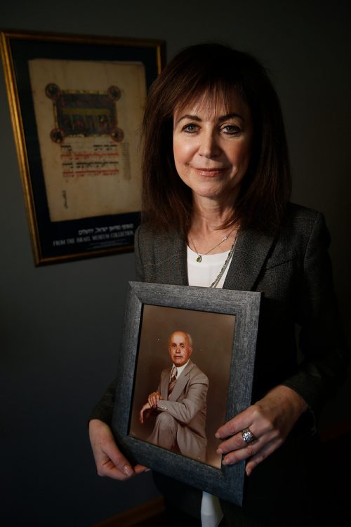 JOHN WOODS / WINNIPEG FREE PRESS
Belle Jarniewski, executive director of Jewish Heritage Centre of Western Canada, holds a photo pf her father Sam in her home in Winnipeg Tuesday, April 30, 2019. Sam Jarniewski, a Holocaust survivor, was liberated from Dachau concentration camp and was among 2500 Jewish tailors and their families who immigrated to Canada through the 1948-49 Tailors Project.

Reporter: Sanders