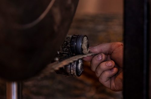 SASHA SEFTER / WINNIPEG FREE PRESS
Owner of WPG Timber Co. Mike McGarry and his girlfriend Carlee Farmer repair a saw blade while processing diseased ash trees into usable lumber in McGarry's warehouse in Winnipeg's Chevrier neighbourhood.
190501 - Wednesday, May 01, 2019.