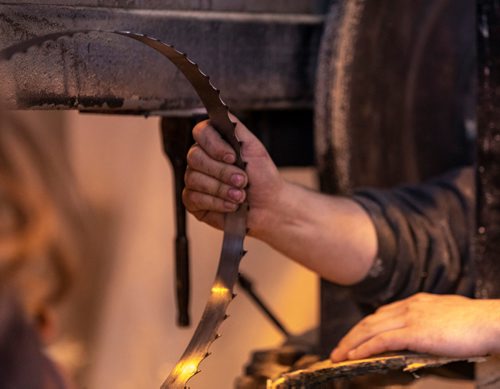 SASHA SEFTER / WINNIPEG FREE PRESS
Owner of WPG Timber Co. Mike McGarry and his girlfriend Carlee Farmer repair a saw blade while processing diseased ash trees into usable lumber in McGarry's warehouse in Winnipeg's Chevrier neighbourhood.
190501 - Wednesday, May 01, 2019.