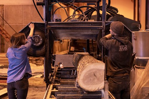 SASHA SEFTER / WINNIPEG FREE PRESS
Owner of WPG Timber Co. Mike McGarry (right) and his girlfriend Carlee Farmer (left) process diseased ash trees into usable lumber in McGarry's warehouse in Winnipeg's Chevrier neighbourhood.
190501 - Wednesday, May 01, 2019.