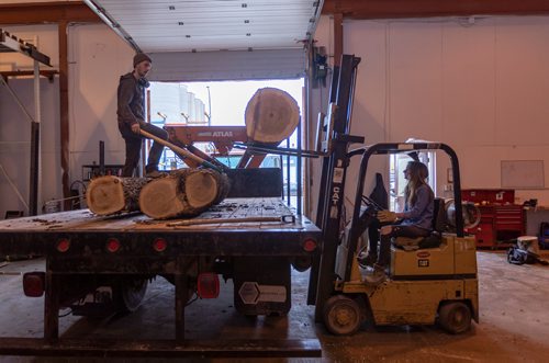 SASHA SEFTER / WINNIPEG FREE PRESS
Owner of WPG Timber Co. Mike McGarry and his girlfriend Carlee Farmer unload diseased ash trees into McGarry's warehouse in Winnipeg's Chevrier neighbourhood.
190501 - Wednesday, May 01, 2019.
