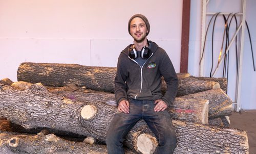 SASHA SEFTER / WINNIPEG FREE PRESS
Owner of WPG Timber Co. Mike McGarry sits on top of some diseased ash trees which he will soon transform into usable lumber in his warehouse in Winnipeg's Chevrier neighbourhood.
190501 - Wednesday, May 01, 2019.