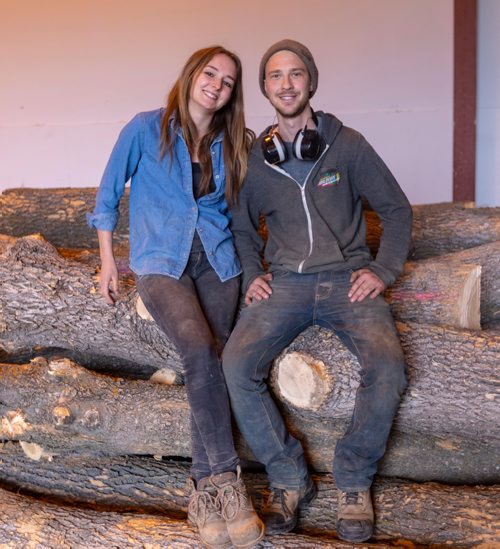 SASHA SEFTER / WINNIPEG FREE PRESS
Owner of WPG Timber Co. Mike McGarry (right) and his girlfriend Carlee Farmer (left) sit on top of some diseased ash trees which they will soon transform into usable lumber in McGarry's warehouse in Winnipeg's Chevrier neighbourhood.
190501 - Wednesday, May 01, 2019.