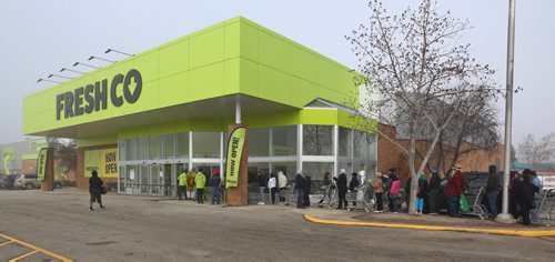 MIKE DEAL / WINNIPEG FREE PRESS
The new FreshCo grocery store is open at McPhilips and Jefferson and people are lined up for a chance to win a $5 dollar gift card. If you want to skip that and go right in the store is open for business. 
190502 - Thursday, May 2, 2019