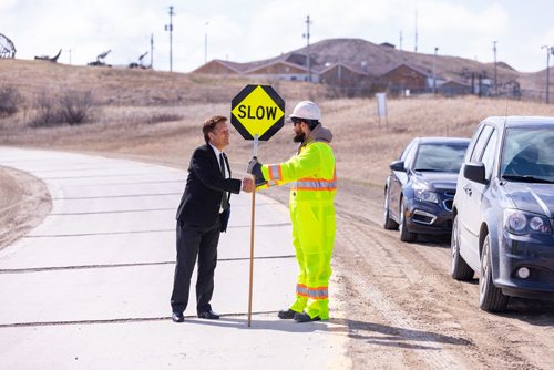 SASHA SEFTER / WINNIPEG FREE PRESS
Minister of Infrastructure Ron Schuler (left) stops to talk with road worker Wade Chomokovski (right) before giving a press conference about plans to build a new bridge over the Red River Floodway on PTH 59 to replace the existing damaged one.
190502 - Thursday, May 02, 2019.