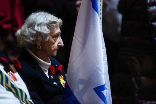 MIKAELA MACKENZIE/WINNIPEG FREE PRESS
Maureen Wiseman holds the flag of Israel before presenting the colours with the General Monash Branch of the Royal Canadian Legion at an annual public commemorative service held in remembrance of the Holocaust at the Manitoba Legislative Building in Winnipeg on Thursday, May 2, 2019. 
Winnipeg Free Press 2019