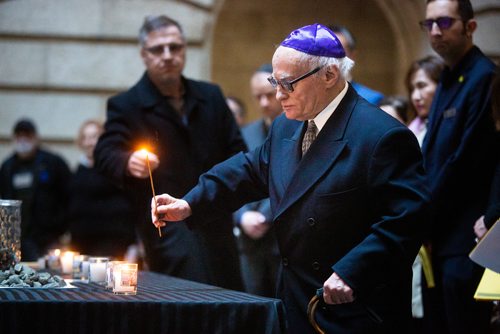 MIKAELA MACKENZIE/WINNIPEG FREE PRESS
Samuel Lantz lights a candle at an annual public commemorative service held in remembrance of the Holocaust at the Manitoba Legislative Building in Winnipeg on Thursday, May 2, 2019. 
Winnipeg Free Press 2019