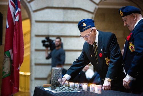 MIKAELA MACKENZIE/WINNIPEG FREE PRESS
Dave Chochinov with the General Monash Branch of the Royal Canadian Legion lays the first ceremonial stone with Barrie Wiseman (right) at an annual public commemorative service held in remembrance of the Holocaust at the Manitoba Legislative Building in Winnipeg on Thursday, May 2, 2019. 
Winnipeg Free Press 2019