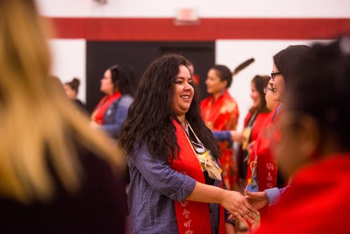 MIKAELA MACKENZIE / WINNIPEG FREE PRESS
Red River graduate Veronica Cameron shakes hands with fellow graduates at the Graduation Pow Wow on Friday, May 3, 2019. For Alex Paul story.
Winnipeg Free Press 2019.