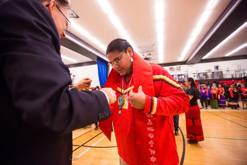 MIKAELA MACKENZIE / WINNIPEG FREE PRESS
Red River indigenous languages graduate Dion Wood is presented with a new Indigenous stole by president Paul Vogt at the Graduation Pow Wow on Friday, May 3, 2019. For Alex Paul story.
Winnipeg Free Press 2019.