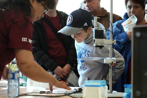 RUTH BONNEVILLE / WINNIPEG FREE PRESS 

Ethan Olson (8yrs), looks into a petri dish in the atrium of  Canada's Virology Lab while attending their open house with his parents on Saturday.  

VIROLOGY LAB:  Canadas only Biosafety Level 4 infectious disease facility held a open house for its 20th anniversary of the Canadian Science Centre for Human and Animal Health Saturday.   

See Bill Redekop story. 

May 4, 2019

