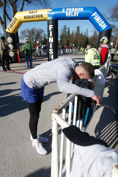 JOHN WOODS / WINNIPEG FREE PRESS
A runners recovers after completing the Winnipeg Police Service Half Marathon at Assiniboine Park in Winnipeg Sunday, May 5, 2019.

Reporter: Alex