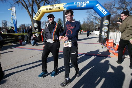 JOHN WOODS / WINNIPEG FREE PRESS
Blind runner Tracy Garbutt finishes the Winnipeg Police Service Half Marathon with the assistance of his son Theo at Assiniboine Park in Winnipeg Sunday, May 5, 2019.

Reporter: Alex