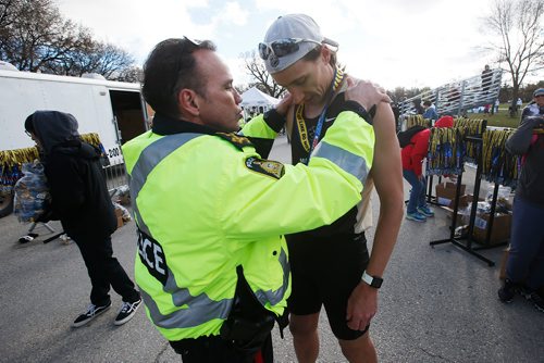 JOHN WOODS / WINNIPEG FREE PRESS
Police chief Deny Smith gives Nickolas Kosmenko who won the Winnipeg Police Service Half Marathon with a time of 1:12:15.7, a medal at Assiniboine Park in Winnipeg Sunday, May 5, 2019.

Reporter: Alex