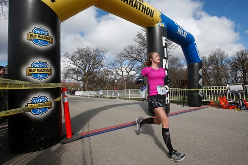 JOHN WOODS / WINNIPEG FREE PRESS
The fastest female runner Robynn Clark crosses the finish line in 1:29:47 at the Winnipeg Police Service Half Marathon at Assiniboine Park in Winnipeg Sunday, May 5, 2019.

Reporter: Alex
