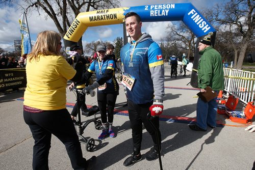 JOHN WOODS / WINNIPEG FREE PRESS
Shane Dyck, who was deemed a quadriplegic with 1% chance of walking again after a motorcycle accident August 27 2013, completes the Winnipeg Police Service Half Marathon with his girlfriend Natalie Caister for his mom Irene who died of cancer May 26, 2018 and was there for him in every step of his recovery. The run occurred at Assiniboine Park in Winnipeg Sunday, May 5, 2019.

Reporter: Alex