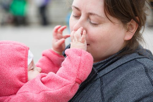 MIKE DEAL / WINNIPEG FREE PRESS
Ashley Ford and her nine-month-old, Daisy,  during a rally on the steps of the Manitoba Legislative building Monday morning. Word is that there are so few jobs in Manitoba for midwives that graduates have to leave the province to get work
See Carol Sanders story. 
190506 - Monday, May 06, 2019.