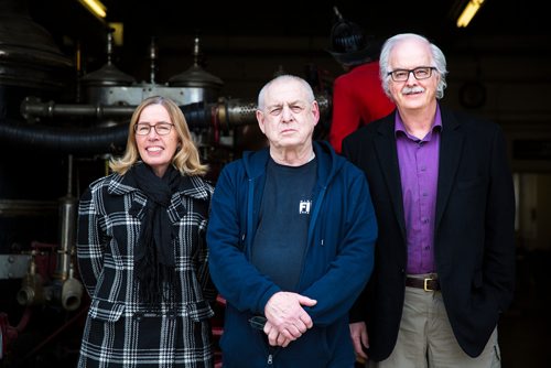 MIKAELA MACKENZIE / WINNIPEG FREE PRESS
Sharon Reilly (left), George Treddenick, and Nolan Reilly  pose at the Maple Street fire hall in Winnipeg on Wednesday, May 8, 2019. This fire hall is where the team was dispatched to put out the streetcar fire during the strike. For Jessica Botelho-Urbanski story.
Winnipeg Free Press 2019.