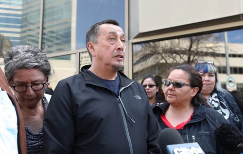 RUTH BONNEVILLE / WINNIPEG FREE PRESS 

George and his wife Melinda Wood, parents of murder victim Christine Wood, are surrounded by friends and family as George makes a statement to the media regarding the sentencing of Brett Overby who was convicted of 2nd degree murder, on Wednesday outside the Law Courts building 

May 8, 2019

