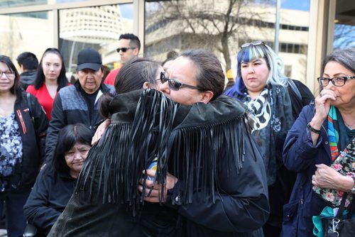 RUTH BONNEVILLE / WINNIPEG FREE PRESS 

wife Melinda Wood, mother of  murder victim Christine Wood, is hugged after her husband, George, makes a statement to the media regarding the sentencing of Brett Overby who was convicted of 2nd degree murder, on Wednesday outside the Law Courts building 

May 8, 2019

