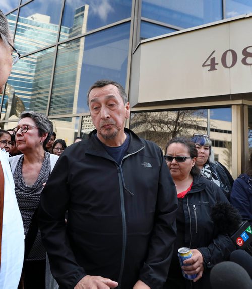 RUTH BONNEVILLE / WINNIPEG FREE PRESS 

George and his wife Melinda Wood, parents of murder victim Christine Wood, are surrounded by friends and family after George makes a statement to the media regarding the sentencing of Brett Overby who was convicted of 2nd degree murder, on Wednesday outside the Law Courts building 

May 8, 2019

