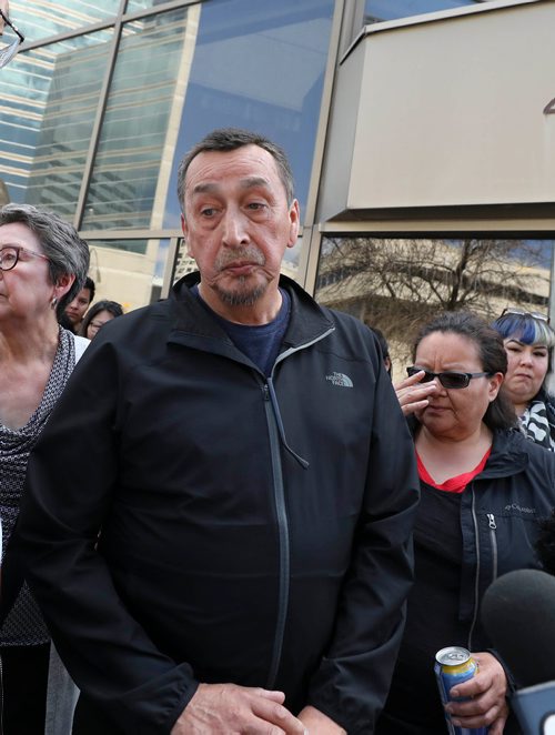 RUTH BONNEVILLE / WINNIPEG FREE PRESS 

George and his wife Melinda Wood, parents of murder victim Christine Wood, are surrounded by friends and family after George makes a statement to the media regarding the sentencing of Brett Overby who was convicted of 2nd degree murder, on Wednesday outside the Law Courts building 

May 8, 2019

