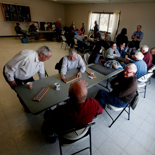 PHIL HOSSACK / WINNIPEG FREE PRESS - Twice a week retiree's gather at the Woodhaven CC where the "Mens Shack" hangs out over coffee carving and conversation.Howard Lancaster (left) sits with friends Warren Loewen, Dennis Cole and Ken Miller (clockwise from Howard) for a game of cribbage.  - .....See Brenda Suderman's story. .  - May 8, 2019.