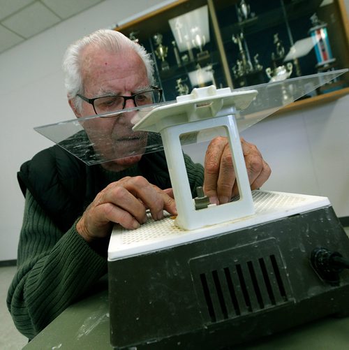 PHIL HOSSACK / WINNIPEG FREE PRESS - Twice a week retiree's gather at the Woodhaven CC where the "Mens Shack" hangs out over coffee carving and conversation.Donald Shepherd cuts glass for a stained glass project.   - .....See Brenda Suderman's story. .  - May 8, 2019.