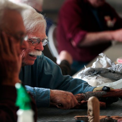 PHIL HOSSACK / WINNIPEG FREE PRESS - Twice a week retiree's gather at the Woodhaven CC where the "Mens Shack" hangs out over coffee carving and conversation.Doug Mackie works his carving knife into a piece of Cottonwood bark.  - .....See Brenda Suderman's story. .  - May 8, 2019.