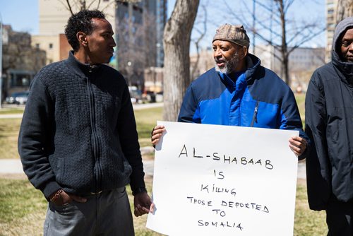 MIKAELA MACKENZIE / WINNIPEG FREE PRESS
Abdirahman Ahmen (left) and Bazi Mohamed at a rally against deportation of Somalis at Central Park in Winnipeg on Thursday, May 9, 2019.  The demonstration was instigated by CBSA deportation of young Somali men who haven't lived there in decades and are in danger. For Carol Sanders story.
Winnipeg Free Press 2019.