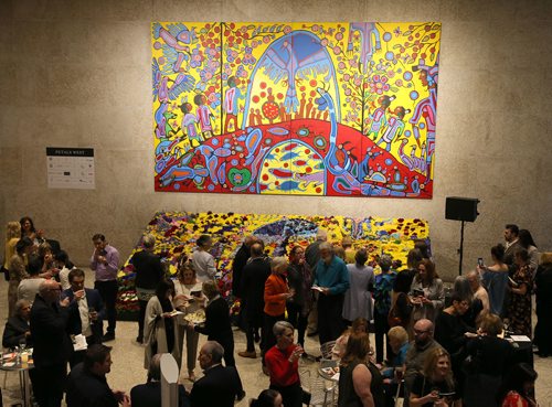 JASON HALSTEAD / WINNIPEG FREE PRESS

Attendees check out the floral interpretation of artist Norval Morrisseau's painting Androgyny at the Art in Bloom Preview Party at the Winnipeg Art Gallery on April 11, 2019. (See Social Page)