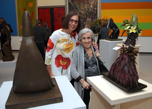 JASON HALSTEAD / WINNIPEG FREE PRESS

L-R: Sharon Goszer-Tritt and her mom Barbara Goszer check out Tracy Musson Sitar's floral interpretation of Giacomo Manzu's sculpture Seated Cardinal at the Art in Bloom Preview Party at the Winnipeg Art Gallery on April 11, 2019. (See Social Page)