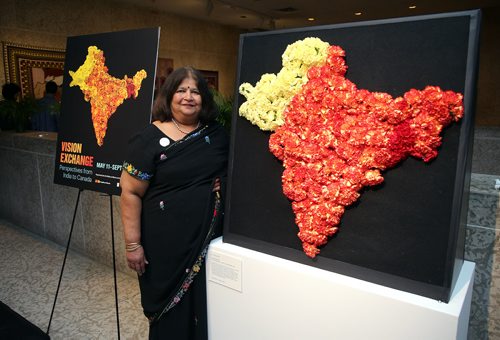 JASON HALSTEAD / WINNIPEG FREE PRESS

Artist Manju Lodha with her floral interpretation of artist Sarindar Dhaliwal's work The cartographer's mistake: the Radcliffe Line at the Art in Bloom Preview Party at the Winnipeg Art Gallery on April 11, 2019. (See Social Page)