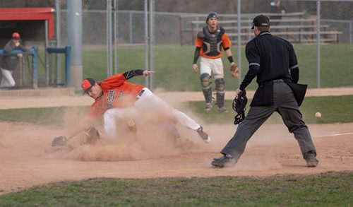 SASHA SEFTER / WINNIPEG FREE PRESS
St. Boniface Legionaires player Michel Fournier (19) slides into homes base to score as Pembina Valley Orioles pitcher Seth Staple jumps out of the way during the third inning of a game at the Whittier park baseball diamond.
190510 - Friday, May 10, 2019.