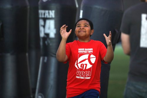 RUTH BONNEVILLE / WINNIPEG FREE PRESS 

Jorel Thomas waits to catch the football after pushing through tackling bags during the  10th annual KidSport Winnipeg Football Camp held at the Axworthy Health & RecPlex on Saturday.

See Ashley Prest story. 

May 11, 2019
