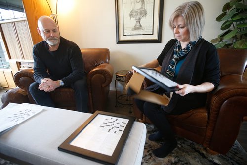 JOHN WOODS / WINNIPEG FREE PRESS
Leanne Cadieux unwraps framed copies of a personalized crossword that Leanne had created for her husband Rons birthday in their Winnipeg home Sunday, May 12, 2019.

Reporter: Zoratti