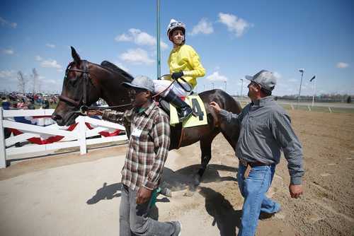 JOHN WOODS / WINNIPEG FREE PRESS
Jockey Alex smiles at trainer Cruz Juan Pablo Silva, after, after he and Kaufy Buzz and won the first race on opening day at Assiniboia Downs in Winnipeg Sunday, May 12, 2019.

Reporter: Sports Feature