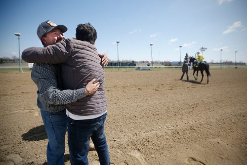 JOHN WOODS / WINNIPEG FREE PRESS
Trainer Juan Pablo Silva, left, is congratulated after his horse Kaufy Buzz and jockey Alex Cruz won the first race on opening day at Assiniboia Downs in Winnipeg Sunday, May 12, 2019.

Reporter: Sports Feature