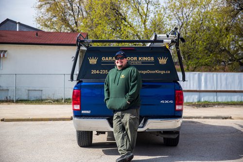 MIKAELA MACKENZIE / WINNIPEG FREE PRESS
Garage Door King Stan Summers poses for a portrait on Logan Ave. in Winnipeg on Monday, May 13, 2019.  For Dave Sanderson story.
Winnipeg Free Press 2019.