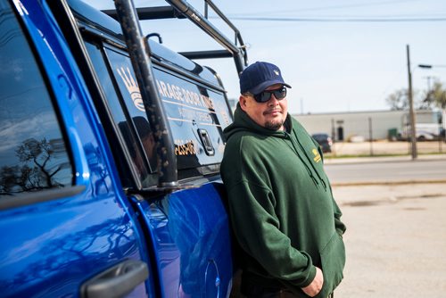 MIKAELA MACKENZIE / WINNIPEG FREE PRESS
Garage Door King Stan Summers poses for a portrait on Logan Ave. in Winnipeg on Monday, May 13, 2019.  For Dave Sanderson story.
Winnipeg Free Press 2019.