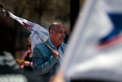 PHIL HOSSACK / WINNIPEG FREE PRESS - ATU Local 1505 President holds a flag as Amalgamated Transit Union members wave flags and hand out leaflets outlining their protest action tomorrow at Edmonton St. and Graham ave Monday at noon hour. See Bill Redekop story.  - May13, 2019.