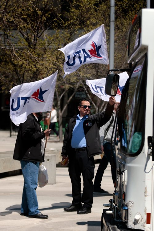 PHIL HOSSACK / WINNIPEG FREE PRESS - Amalgamated Transit Union members wave flags and hand out leaflets outlining their protest action tomorrow at Edmonton St. and Graham ave Monday at noon hour. See Bill Redekop story.  - May13, 2019.