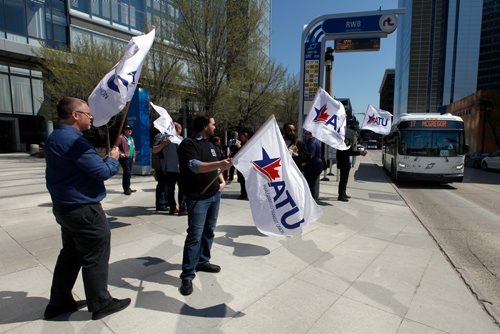 PHIL HOSSACK / WINNIPEG FREE PRESS - Amalgamated Transit Union members wave flags and hand out leaflets outlining their protest action tomorrow at Edmonton St. and Graham ave Monday at noon hour. See Bill Redekop story.  - May13, 2019.