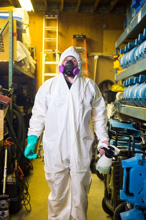 MIKAELA MACKENZIE / WINNIPEG FREE PRESS
Scott Rose, owner and general manager of WinMar property restoration, poses for a portrait in cleanup gear with stored air moving machines and dehumidifiers at their facility in Winnipeg on Monday, May 13, 2019.  For Erin Lebar story.
Winnipeg Free Press 2019.