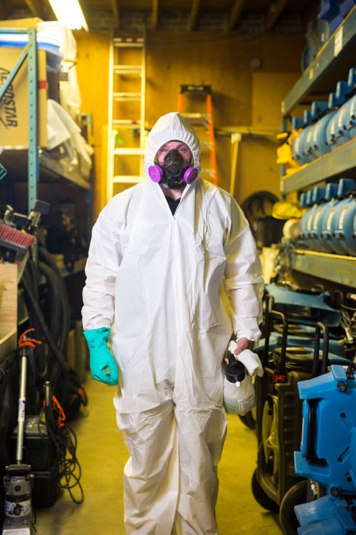 MIKAELA MACKENZIE / WINNIPEG FREE PRESS
Scott Rose, owner and general manager of WinMar property restoration, poses for a portrait in cleanup gear with stored air moving machines and dehumidifiers at their facility in Winnipeg on Monday, May 13, 2019.  For Erin Lebar story.
Winnipeg Free Press 2019.