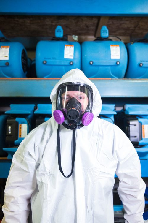 MIKAELA MACKENZIE / WINNIPEG FREE PRESS
Scott Rose, owner and general manager of WinMar property restoration, poses for a portrait in cleanup gear with stored air moving machines and dehumidifiers at their facility in Winnipeg on Monday, May 13, 2019.  For Erin Lebar story.
Winnipeg Free Press 2019.