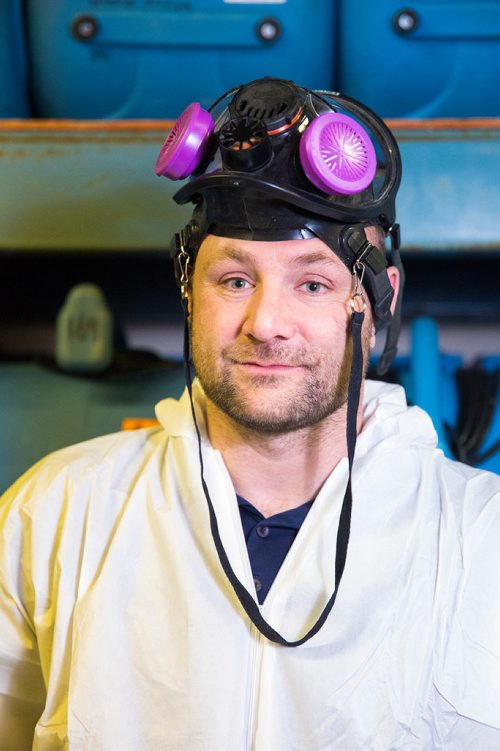 MIKAELA MACKENZIE / WINNIPEG FREE PRESS
Scott Rose, owner and general manager of WinMar property restoration, poses for a portrait in cleanup gear with stored air moving machines and dehumidifiers at their facility in Winnipeg on Monday, May 13, 2019.  For Erin Lebar story.
Winnipeg Free Press 2019.