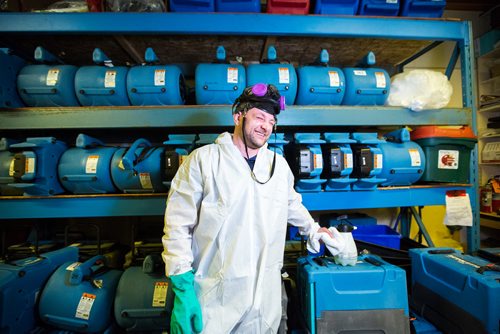 MIKAELA MACKENZIE / WINNIPEG FREE PRESS
Scott Rose, owner and general manager of WinMar property restoration, poses for a portrait in cleanup gear with stored air moving machines and dehumidifiers at their facility in Winnipeg on Monday, May 13, 2019.  For Erin Lebar story.
Winnipeg Free Press 2019.