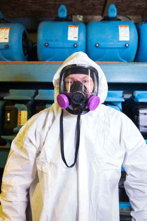 MIKAELA MACKENZIE / WINNIPEG FREE PRESS
Scott Rose, owner and general manager of WinMar property restoration, poses for a portrait in cleanup gear with stored air moving machines and dehumidifiers at their facility in Winnipeg on Monday, May 13, 2019.  For Erin Lebar story.
Winnipeg Free Press 2019.