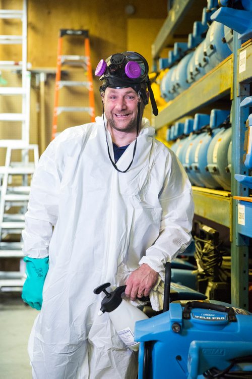 MIKAELA MACKENZIE / WINNIPEG FREE PRESS
Scott Rose, owner and general manager of WinMar property restoration, poses for a portrait in cleanup gear with stored air moving machines and dehumidifiers at their facility in Winnipeg on Monday, May 13, 2019.  For Erin Lebar story.
Winnipeg Free Press 2019.